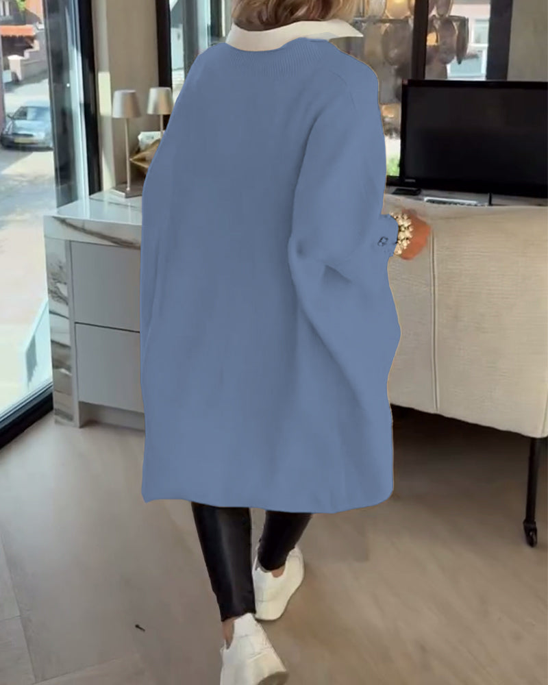סוודר עם צווארון V, כפתורים ועיצוב אסימטרי