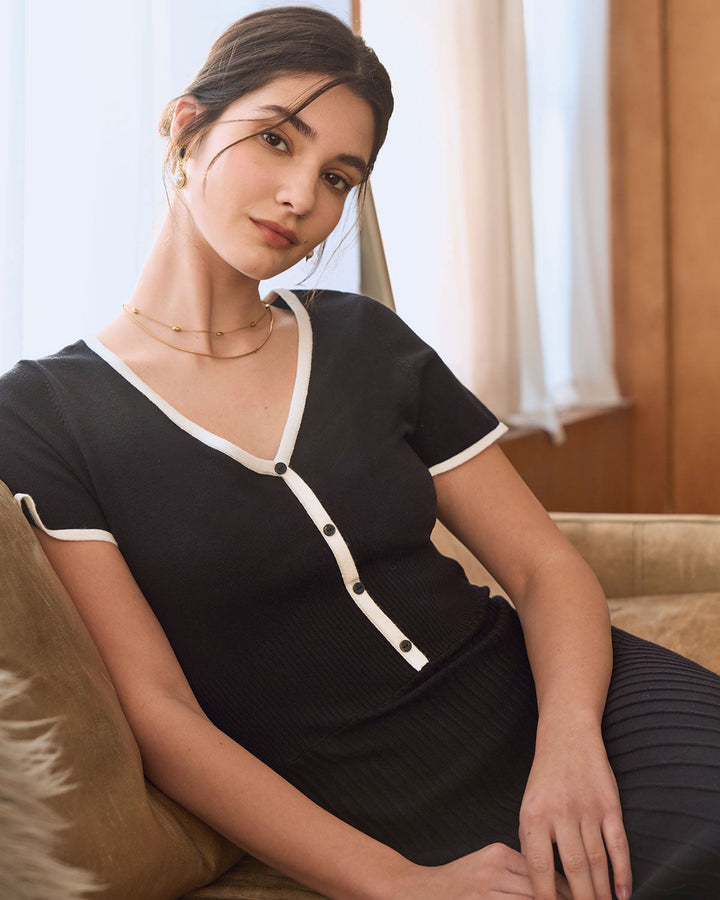 Schwarzes Midikleid mit kontrastierendem Pullover-Stil